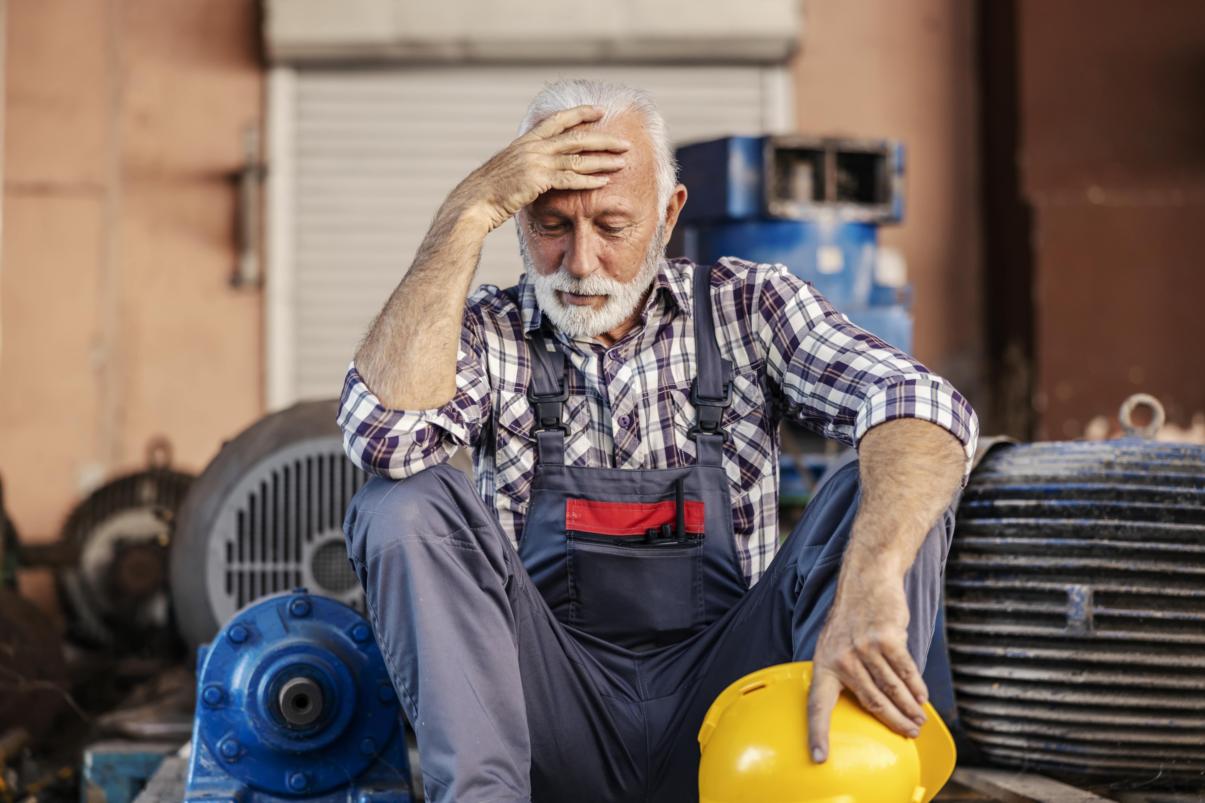 Photo of senior struggling to keep up with work in retirement age